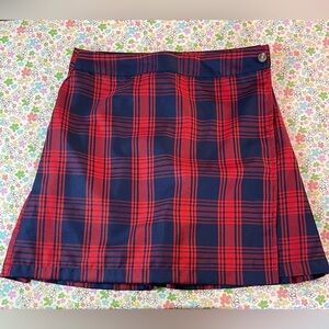 Plaid schoolgirl wrap skirt. Flat front pleated back. Size small. NWOT